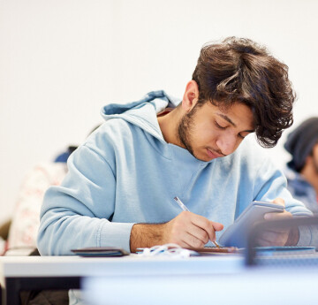 International student looking at laptop 